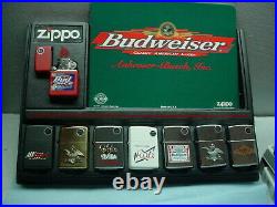 Store display of eight Budwiser Zippos new in the boxes and unfired 1998 vintage